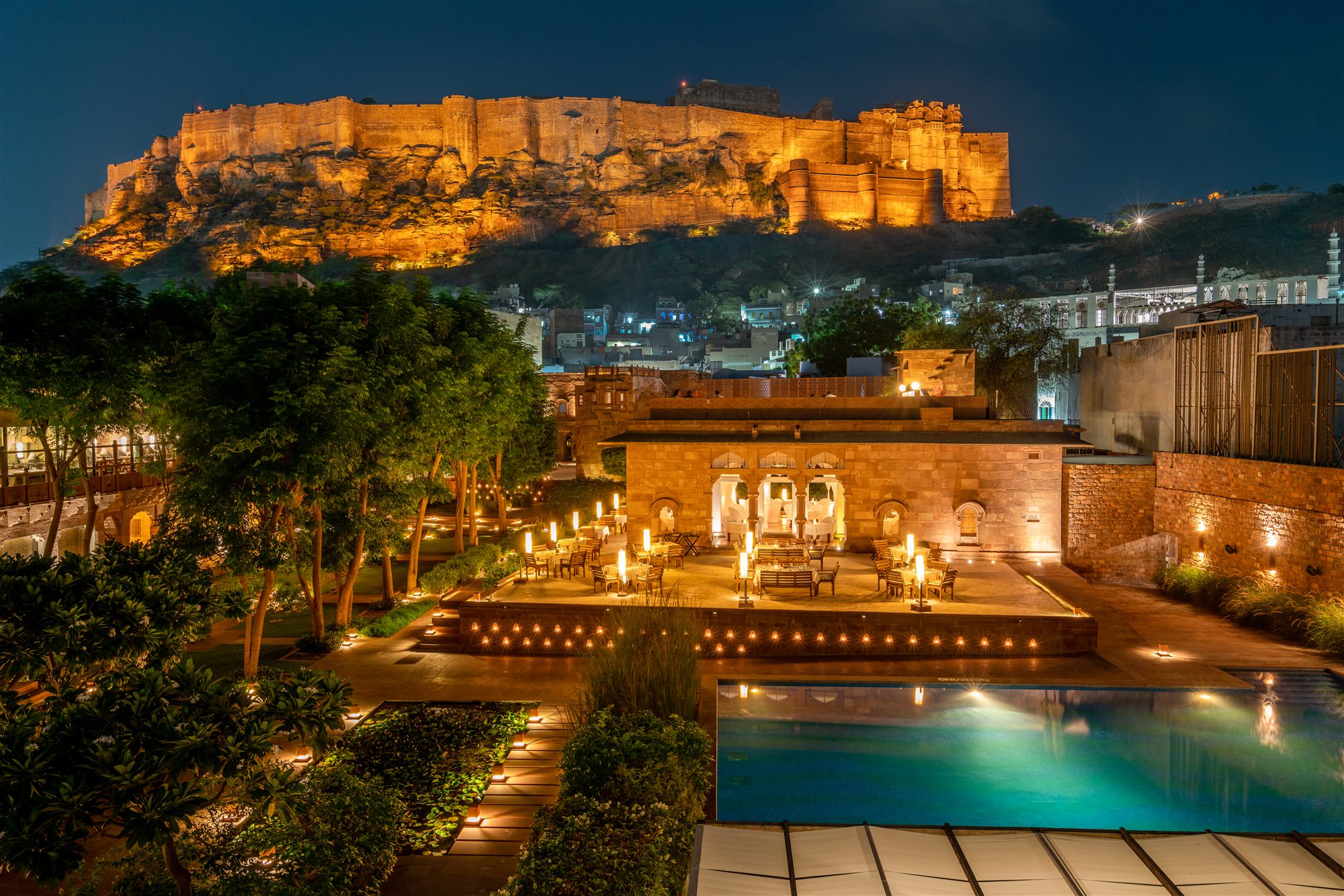 RAAS Jodhpur beneath Mehrangarh Fort at night, Rajasthan, India
